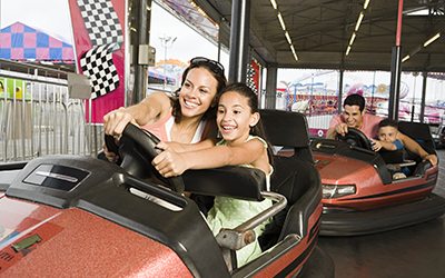 Family in bumper cars Family in bumper cars
