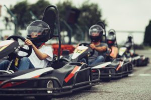 Family and friends driving go carts at Broadway Grand Prix, one of the Myrtle Beach attractions open year round