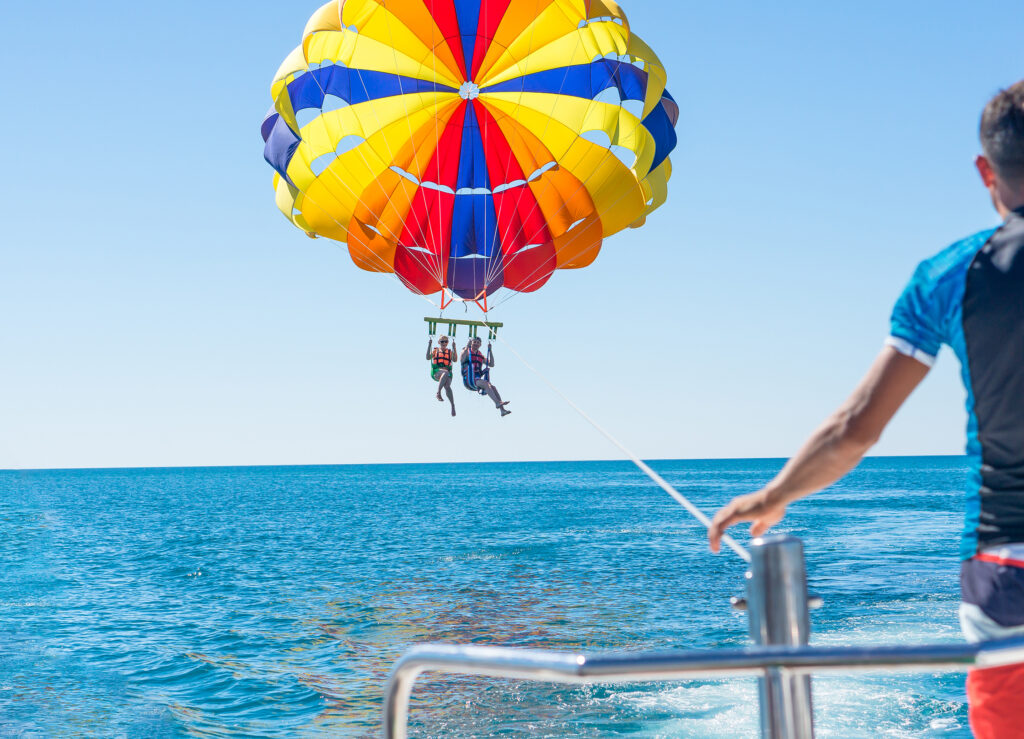 Happy couple Parasailing over the ocean in Myrtle Beach