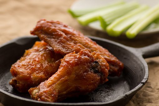 Spicy hot wings with tabasco and sriracha sauce