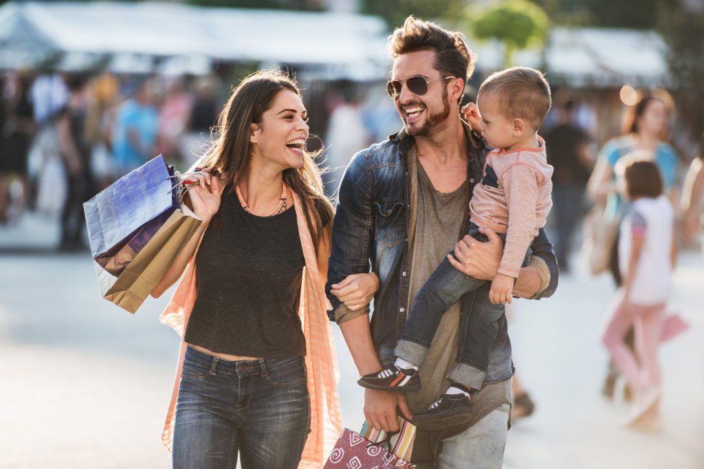 Cheerful family enjoying their day shopping at barefoot landing