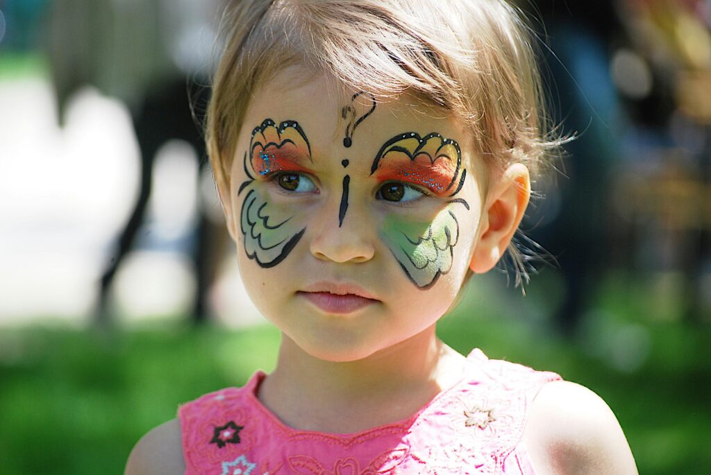 Close up of child with butterfly face painting at one of the top Myrtle Beach Spring Events.
