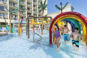 Children running through the water obstacles at Sea Crest's water park