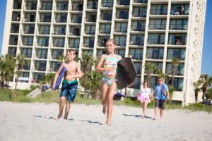 kids running on beach